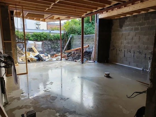 Freshly poured concrete floor and exposed block walls